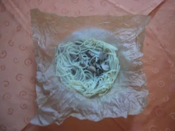 Nudelnester mit Pilzen - Rezept