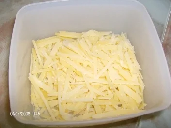 Rezept: Gelbe Kugelzucchini gefüllt neben Schlangenzucchini Gelbe Kugelzucchini gefüllt neben Schlangenzucchini - Rezept