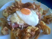 Überbackener Leberkäse im Kartoffelnest - Rezept