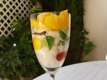 Rezept: Milchreisdessert mit Pfirsichkranz Milchreisdessert mit Pfirsichkranz - Rezept