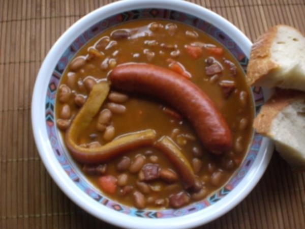 Display of Serbian bean stew with a spoon in the bowl