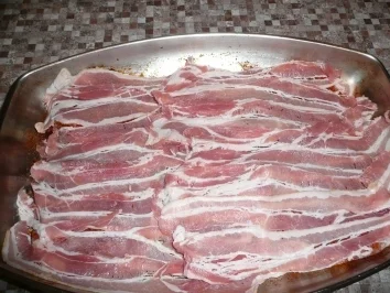 Rezept: Koteletts unter Speckhaube Koteletts unter Speckhaube - Rezept