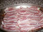 Rezept: Koteletts unter Speckhaube Koteletts unter Speckhaube - Rezept