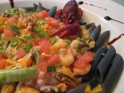 Fruits de Mer in Krustenauce auf schwarzen Penne - Rezept