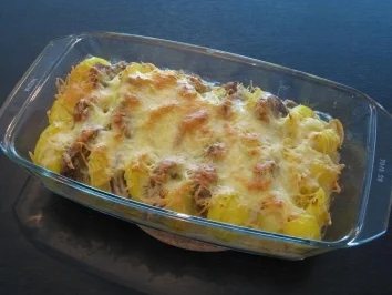 Schweinefilet im Kartoffelgratinbett - Rezept