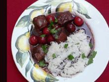 Lammfilet aus dem Wok mit Kirschen und Rotweinsoße an Basmatireis - Rezept