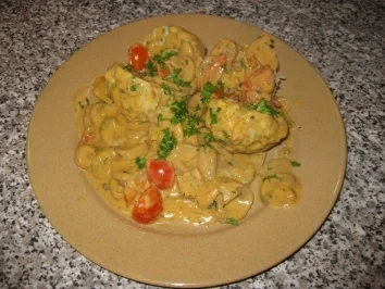 Specksemmelknödel mit Tomaten-Pilz-Sahne-Sauce - Rezept