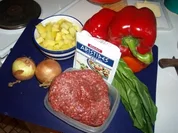 Rezept: Gefรผllte Paprikaschoten auf Rosmarienkartoffeln an kalter Gurkensauce Gefรผllte Paprikaschoten auf Rosmarienkartoffeln an kalter Gurkensauce - Rezept