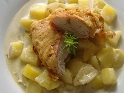 Hähnchenbrust im Schinkenmantel mit Parmesankruste auf Schmorgurkenragout - Rezept
