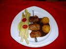 Schweinefiletröllchen gefüllt mit Senf-Tomantenmark und blanchierten Lauch an Balsamicojus - Rezept