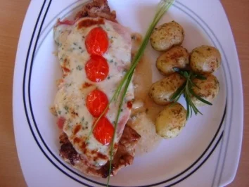 SCHWEINESCHNITZEL UNTER PARMESANCREME - Rezept