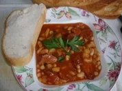 Rote Chillibohnensuppe mit Speck und Mettwürstchen - Rezept