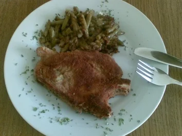 Panierte Koteletts mit gebratenen Bohnen - Rezept