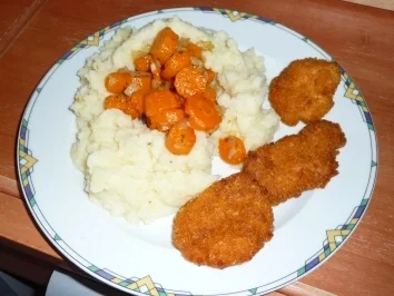 Rezept: Hähnchen-Minischnitzel mit Möhren im Kartoffelnest Bild Nr. 4 Hähnchen-Minischnitzel mit Möhren im Kartoffelnest - Rezept - Bild Nr. 4