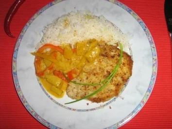 Kokosschnitzel an fruchtigem Ananas-Paprikagemüse - Rezept