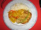 Kokosschnitzel an fruchtigem Ananas-Paprikagemüse - Rezept