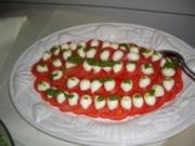 Gäste-Tomaten mit Mozarellakugeln - Rezept