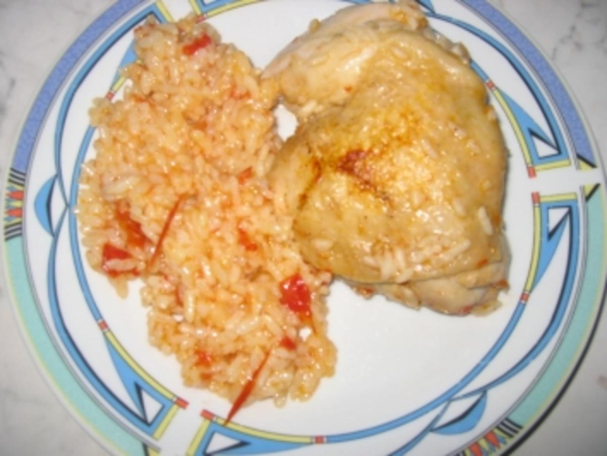 Hähnchenkeulen mit Tomaten und Reis - Rezept
