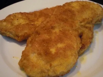 Paniertes Schnitzel mit Zwiebeln und Champions - Rezept