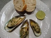 Greenshell-Muscheln mit Kräuterbutter überbacken - Rezept