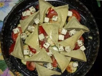 Maultaschenecken auf Zucchini-Tomatenbett mit zweierlei Käse überbacken - Rezept - Bild Nr. 4