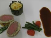 Lammfilet im Kräutermantel an Kartoffelsoufflé im Bohnenzaum - Rezept