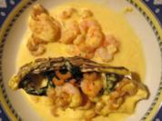 Austern in Champagnersoße garniert mit Krabben und Scampi - Rezept