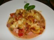 Tortelloni "PEPERONE ROSSO" al forno - Rezept