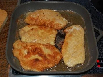 Putenschnitzel mit Schinken Tomaten und Käse überbacken - Rezept - Bild Nr. 2