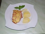 Putenschnitzel mit Schinken Tomaten und Käse überbacken - Rezept