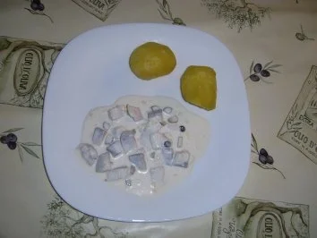 Marinierte Heringe mit Orangensaft - Rezept