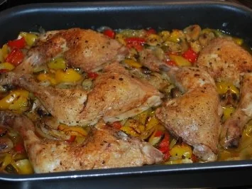 Hähnchenkeulen auf Ofengemüse - Rezept