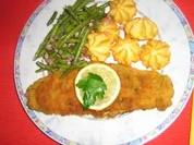 Kräuterschnitzel mit Bohnengemüse und Herzoginkartöffelchen - Rezept