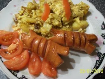 Bratkartoffeln mit gebratener Bockwurst - Rezept
