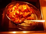 Penne mit Scamorza, Sugo und Parmaschinken - Rezept