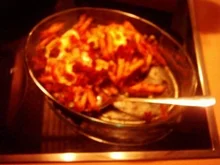 Penne mit Scamorza, Sugo und Parmaschinken - Rezept