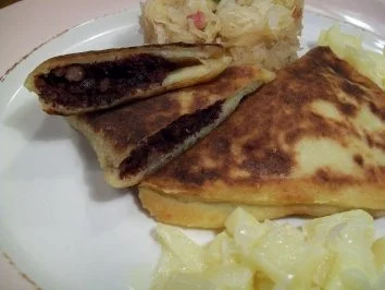 Rezept: gebratene Blutwurst-Kartoffel-Raviolo an Apfel-Zwiebel-Ragout gebratene Blutwurst-Kartoffel-Raviolo an Apfel-Zwiebel-Ragout - Rezept