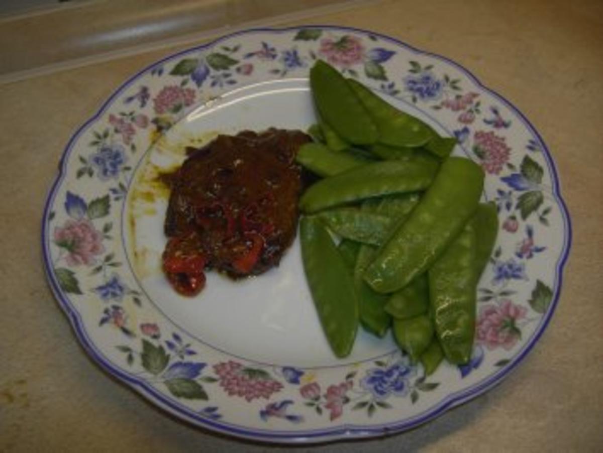 Fleisch - Steffis Schweineschnitzel in  Curry-Orangensoße mit Kaiserschoten - Rezept
