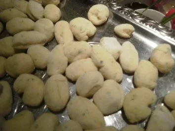 Rezept: Handgemachte Kräutergnocchi mit Tomaten und Parmesan Bild Nr. 9 Handgemachte Kräutergnocchi mit Tomaten und Parmesan - Rezept - Bild Nr. 9