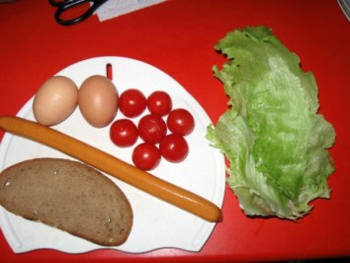 gerührtes Ei mit Würstchen und Tomaten..... - Rezept