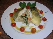 Skreitranchen auf der Haut gebraten an Graupenrisotto und geschmorten Kirschtomaten - Rezept