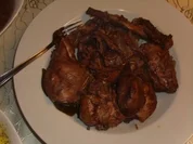 Fleischgerichte: Kaninchen in Rotwein geschmort - Rezept