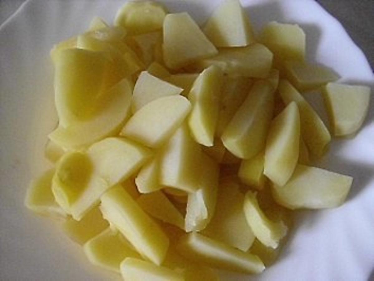 verstecktes Kotelett unterem Spiegelei mit Bratkartoffeln - Rezept - Bild Nr. 2