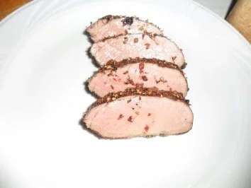 Rezept: Wildschweinrücken mit Pfifferlingen und Kartoffelpuffer Wildschweinrücken mit Pfifferlingen und Kartoffelpuffer - Rezept