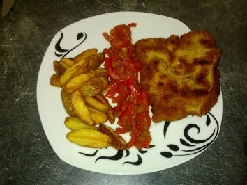 Zigeunerschnitzel mit knusprigen Kartoffelspalten - Rezept