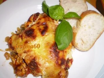 Überbackene Schweinemedallions im Gemüsebett - Rezept