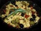 Marinierter Käse mit Kräutern u. Oliven - Rezept