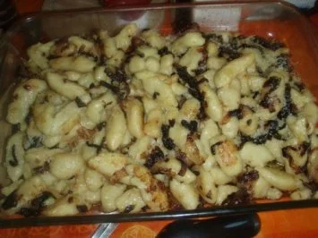 Schupfnudeln an einer Pilzsauce und Salat - Rezept