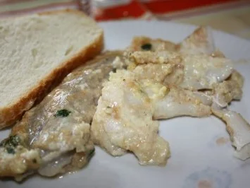 Seelachs in Ei-Kräuter-Mantel - Rezept