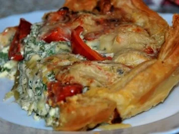 Rezept: Tomaten-Rucola-Tarte mit Meeresfrüchten Tomaten-Rucola-Tarte mit Meeresfrüchten - Rezept